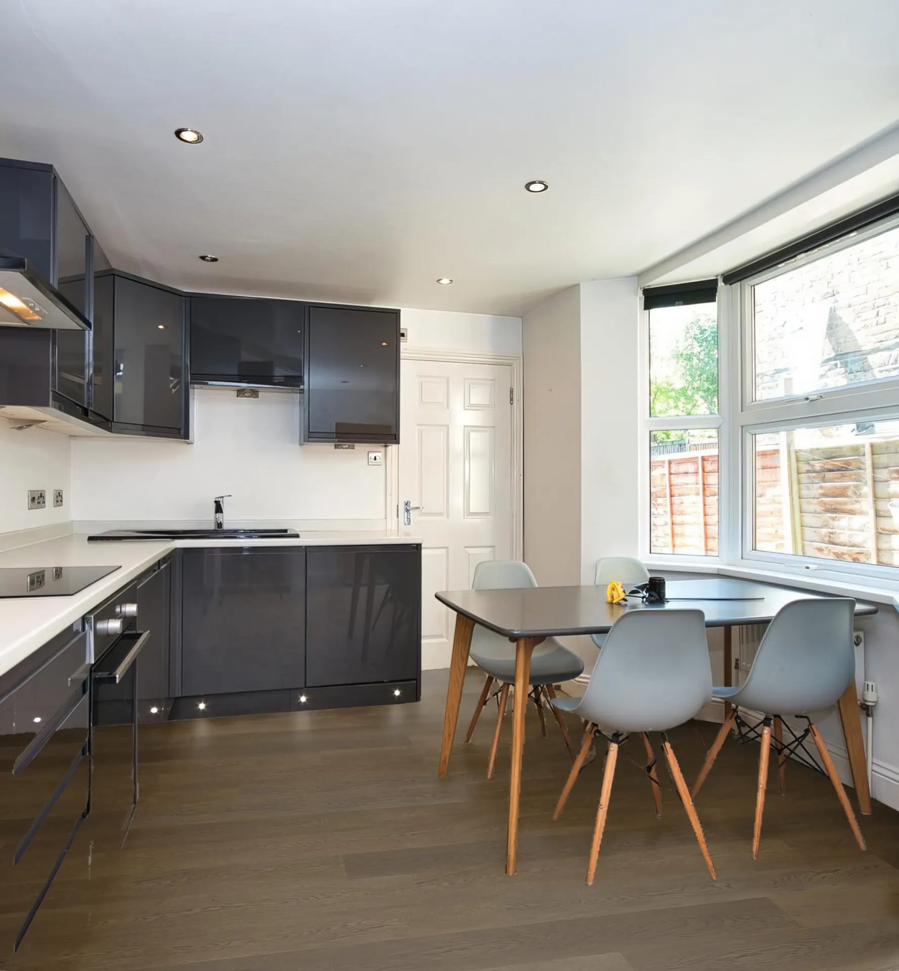 C802 Hurlingham Brown Kitchen: A modern kitchen with Pro-Tek™ Hurlingham Brown flooring, emphasizing its rich brown tones and seamless integration with the interior design.