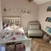 A cozy cottage interior with Chartwell Stone flooring, emphasizing its rustic charm and warm, natural tones. The space is styled with inviting decor, creating a homely ambiance.
