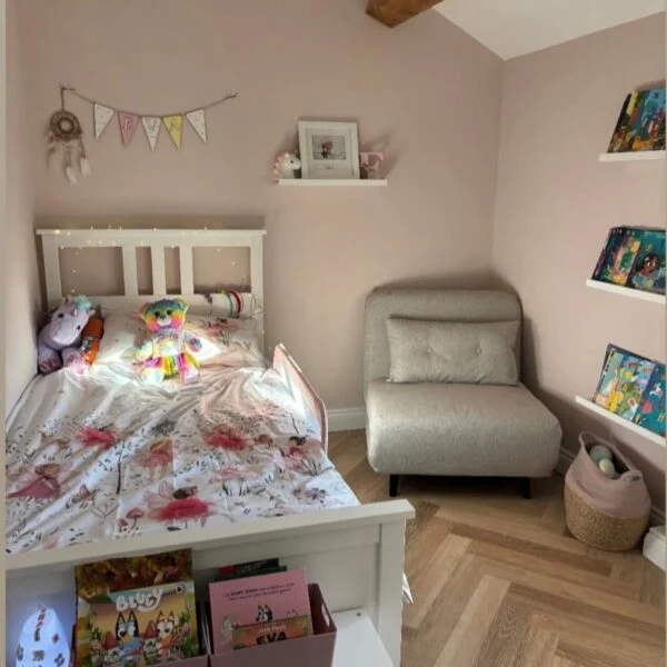 A cozy cottage interior with Chartwell Stone flooring, emphasizing its rustic charm and warm, natural tones. The space is styled with inviting decor, creating a homely ambiance.