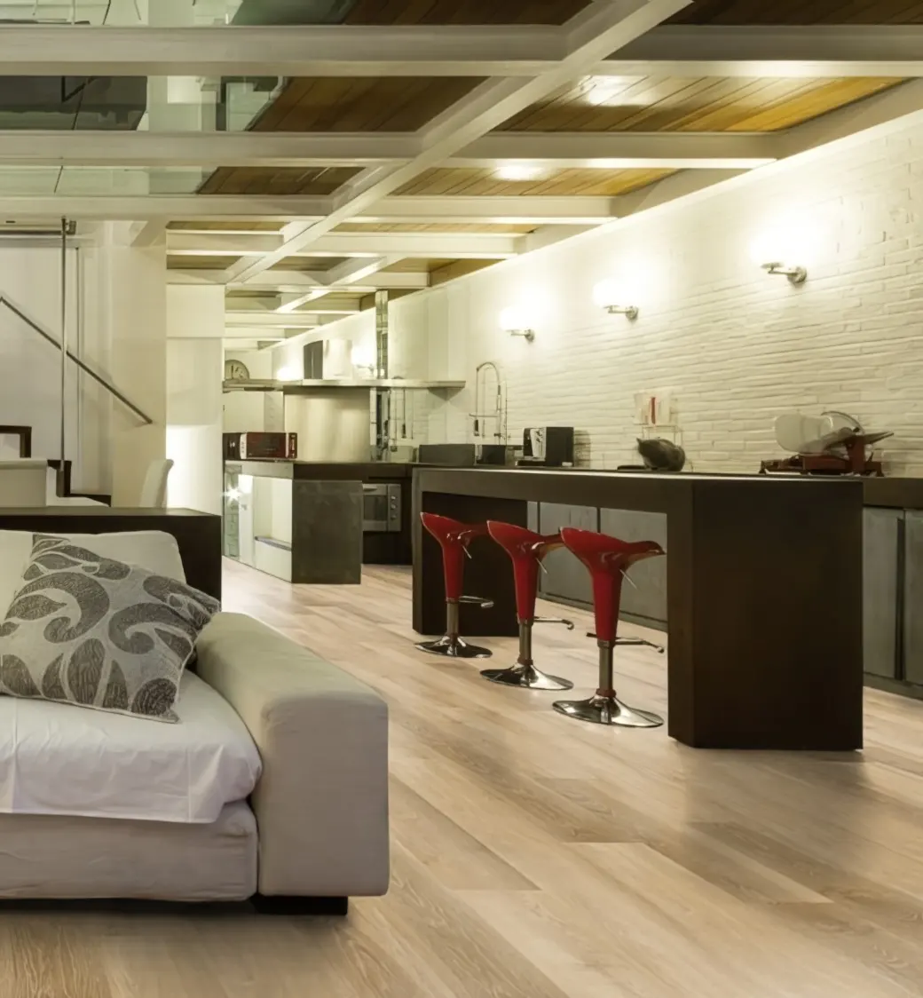 A room set with Editions Classic Richmond Oak flooring from Pro-Tek™ Flooring. The image showcases the rich, oak-coloured flooring, adding warmth and a classic touch to the space.