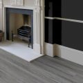 A room set with Editions Classic Rutland Grey flooring from Pro-Tek™ Flooring. The image features the grey-toned flooring, emphasizing its smooth texture and modern aesthetic.