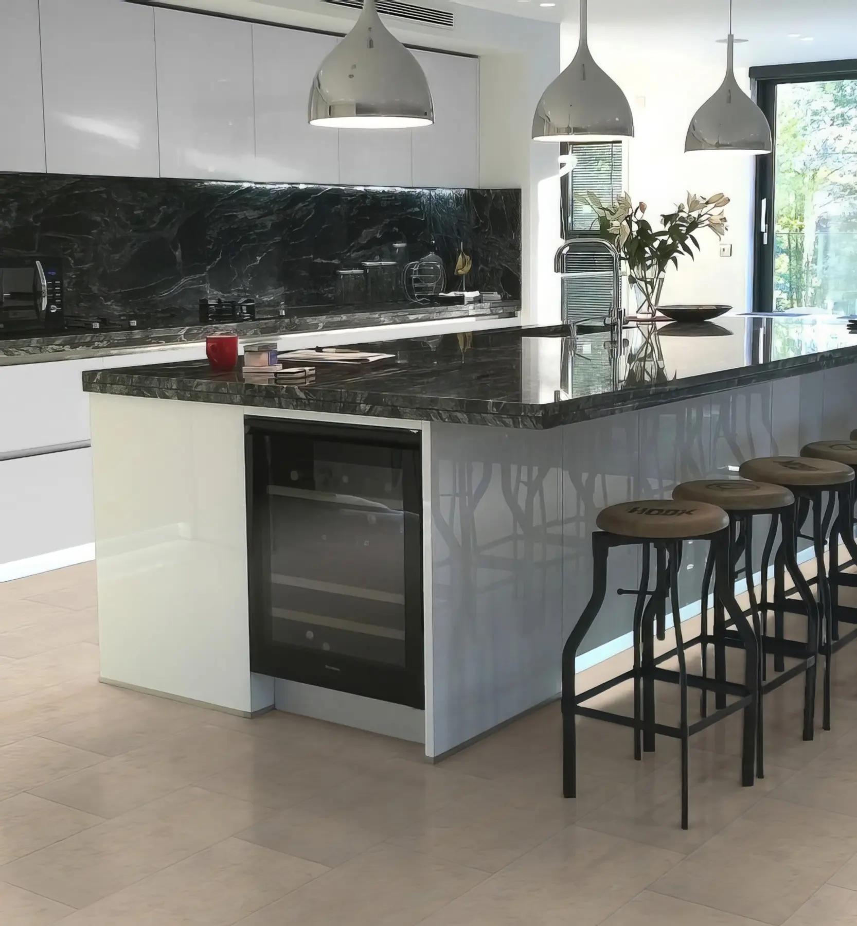 A kitchen with T5000 Ivory Travertine flooring from Pro-Tek™ Flooring. The image displays the warm, ivory-coloured travertine tiles, adding a touch of sophistication and brightness to the space.