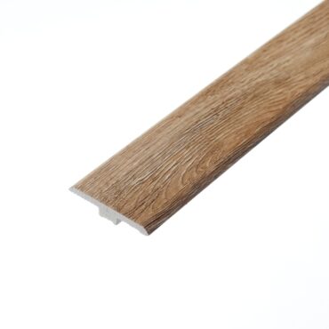 An image of the Hever Oak T-profile. The piece showcases a warm oak colour with natural wood grain textures, designed to connect two floors of the same height seamlessly.