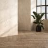 A close-up of Eltham Chino flooring, highlighting its beige-brown hue with delicate wood grain details. This flooring brings a light, airy feel to any room while maintaining a classic wood appearance.